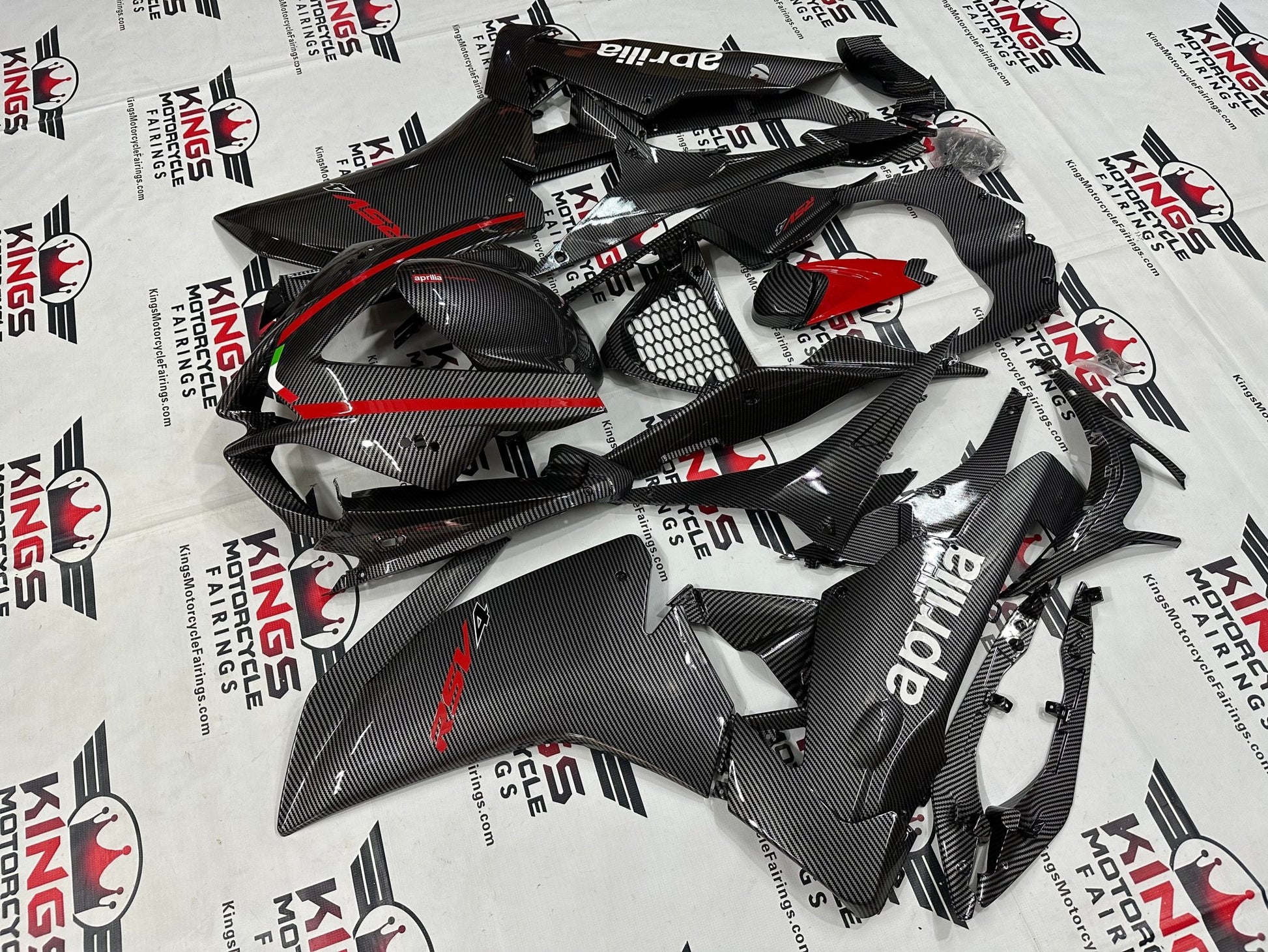 Aprilia RSV4 1000 Fairing Kit (2009-2015) Faux Carbon Fiber, Red at KingsMotorcycleFairings.com