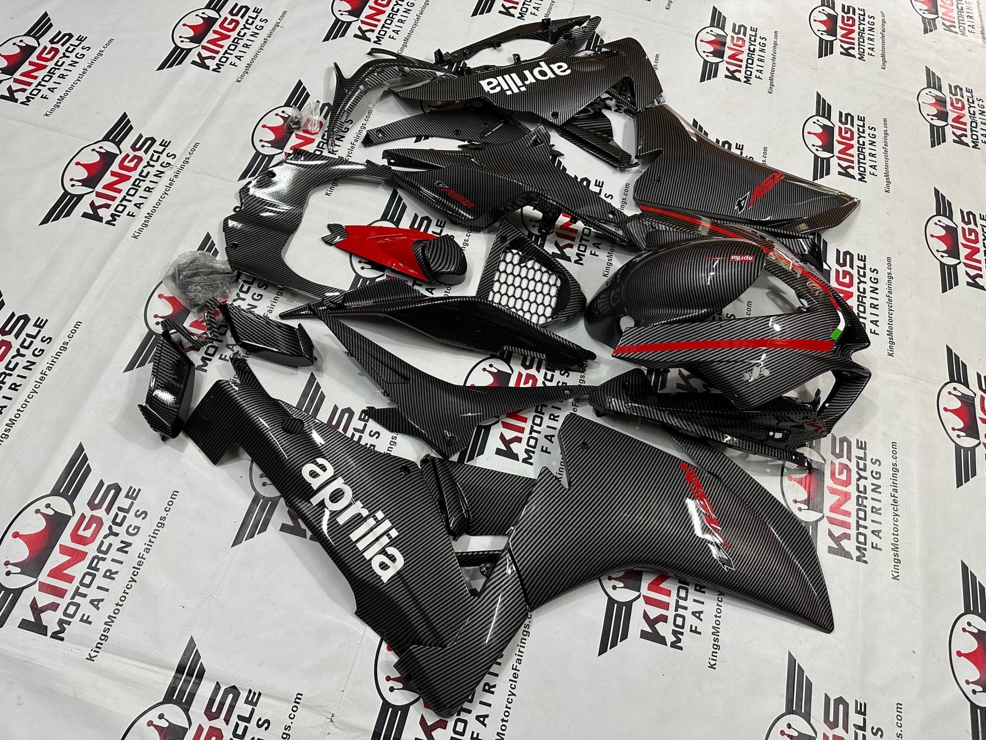 Aprilia RSV4 1000 Fairings (2009-2015) Faux Carbon Fiber, Red from KingsMotorcycleFairings.com