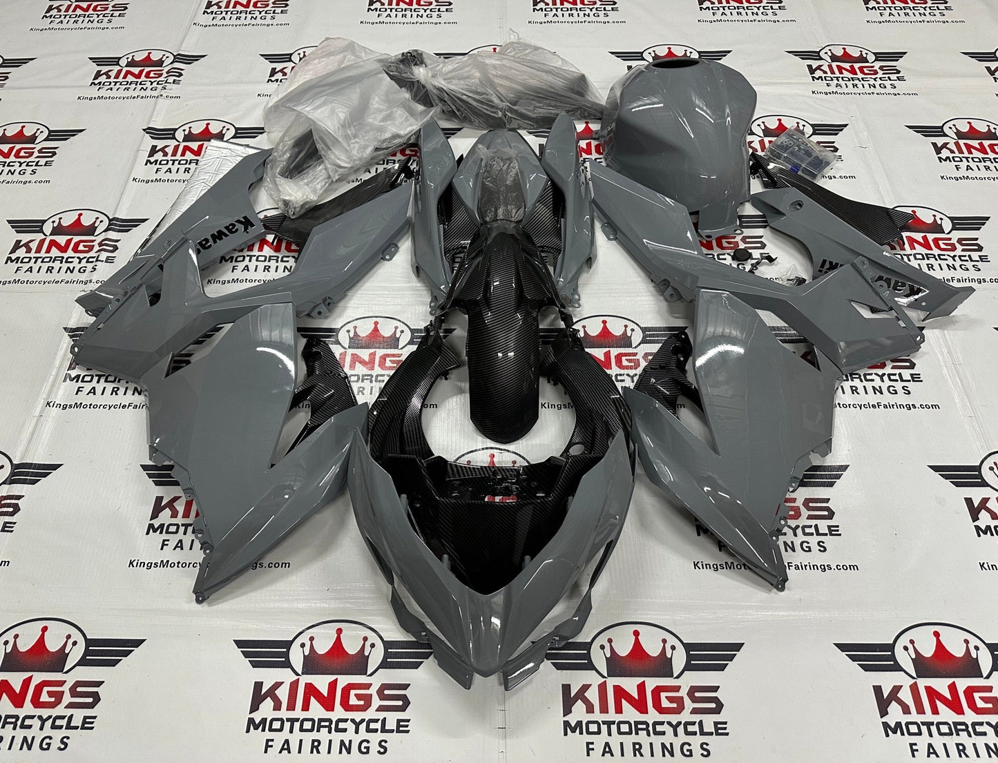 Fairing kit for a Kawasaki Ninja 400 (2018-2023) Dark Nardo Gray & Faux Carbon Fiber at KingsMotorcycleFairings.com