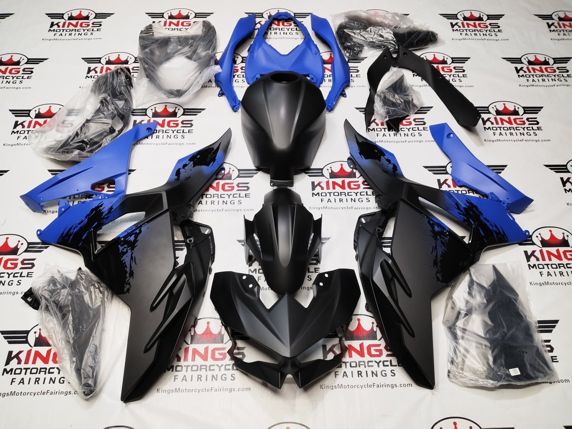 Kawasaki Ninja 500 Fairing Kit (2024-2025) Matte Black, Blue Spray from KingsMotorcycleFairings.com