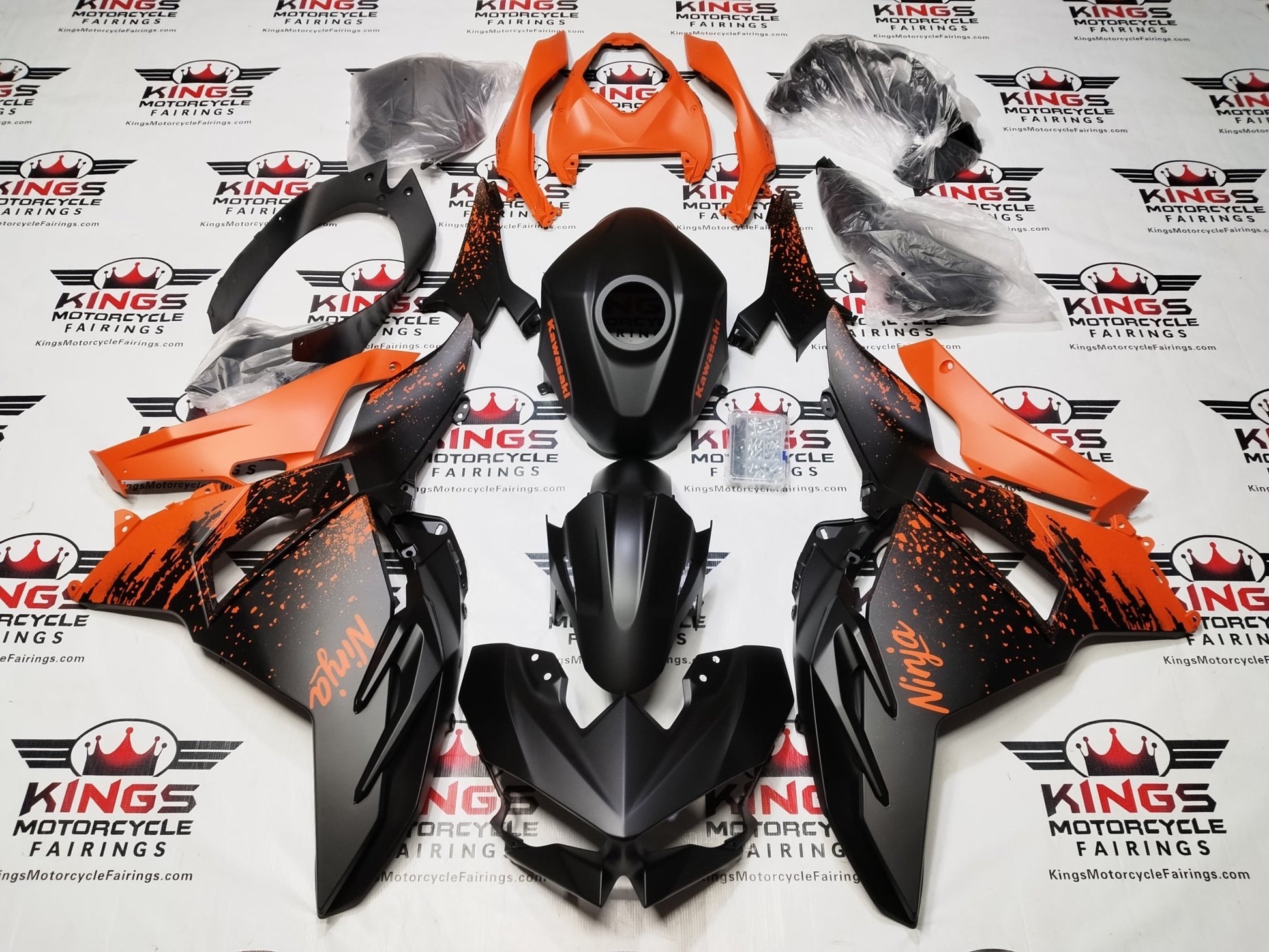 Kawasaki Ninja 500 Fairings (2024-2025) Matte Black, Orange Spray from KingsMotorcycleFairings.com