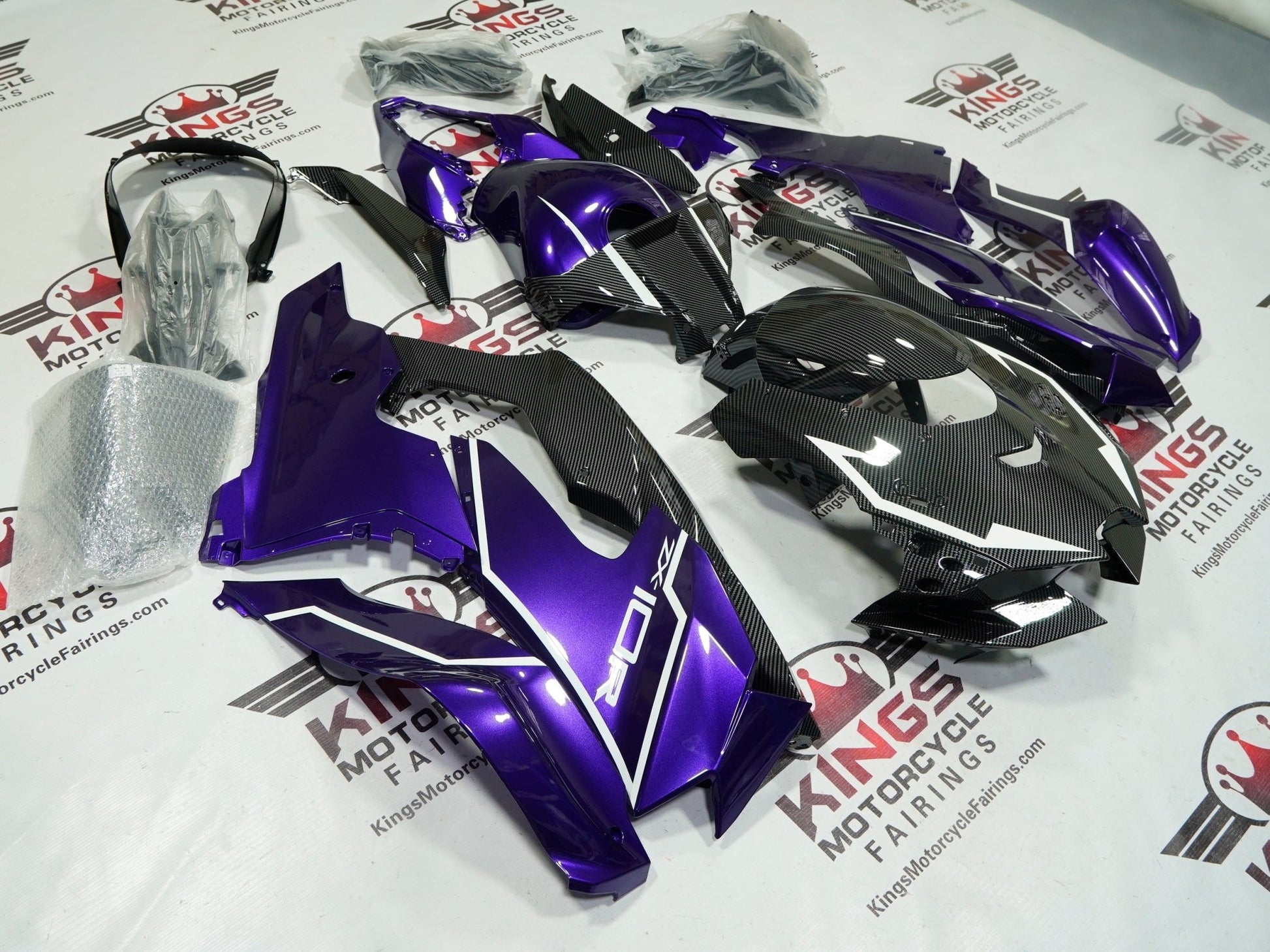 Kawasaki Ninja ZX10R Fairings (2021-2025) Purple, Faux Carbon Fiber, White by KingsMotorcycleFairings.com