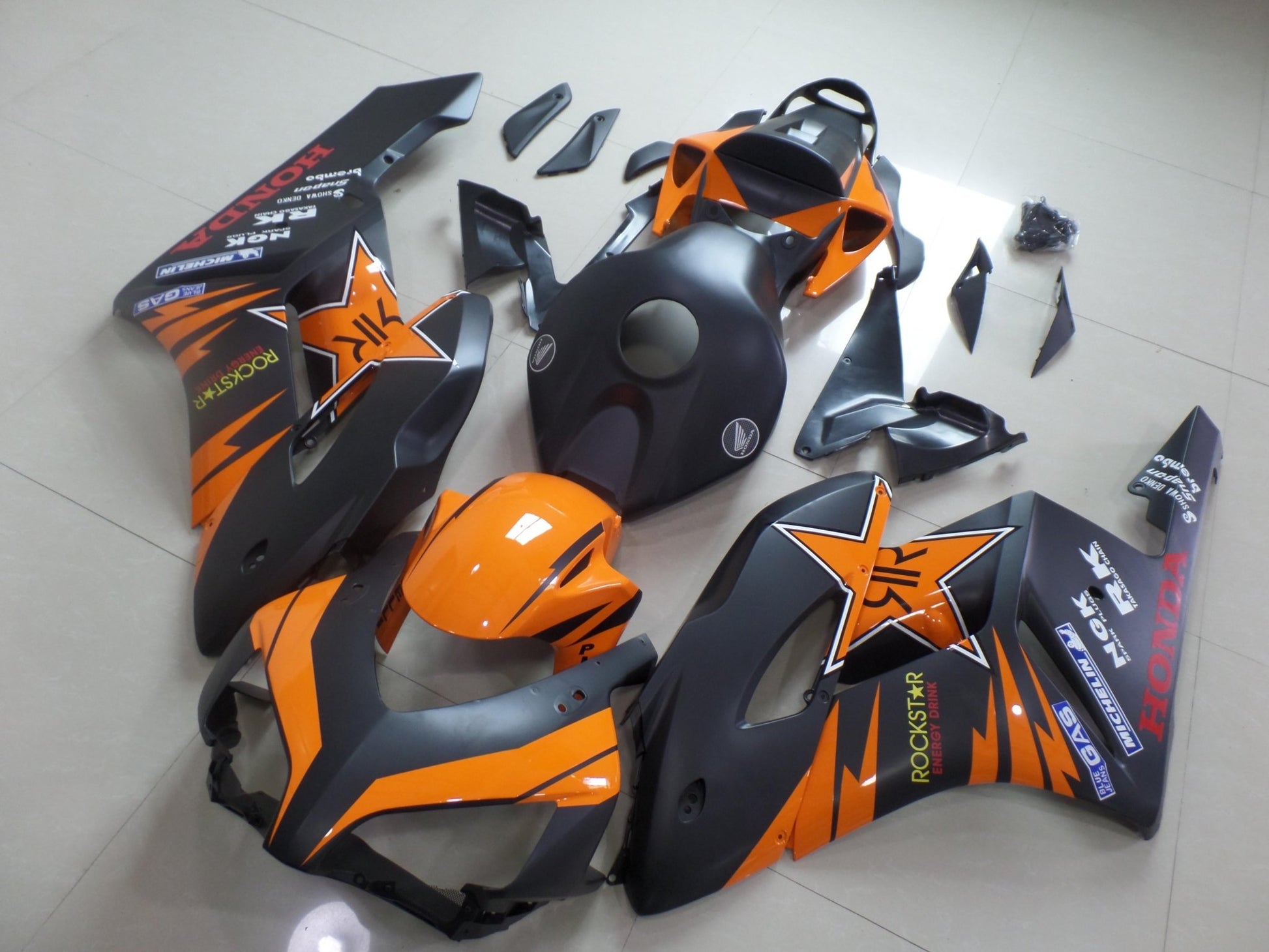 Matte Black and Gloss Orange Rockstar Fairing Kit for a 2004 and 2005 Honda CBR1000RR motorcycle