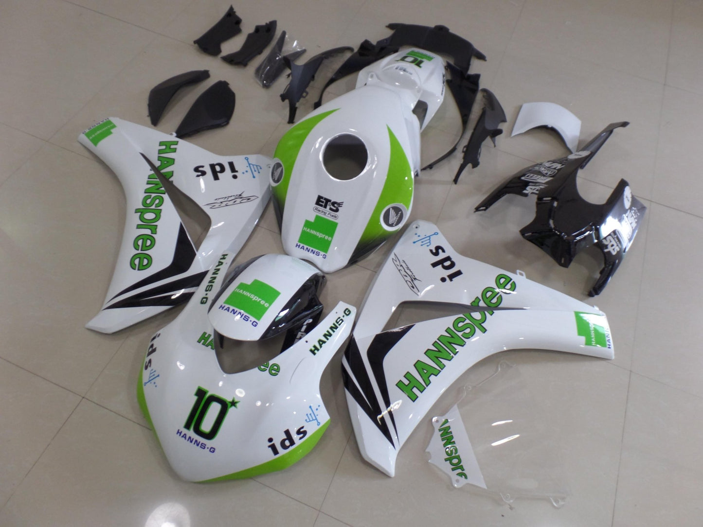 White, Green and Black HANNspree Race Fairing Kit for a 2008, 2009, 2010 & 2011 Honda CBR1000RR motorcycle. This fairing kit is designed specifically for the racetrack