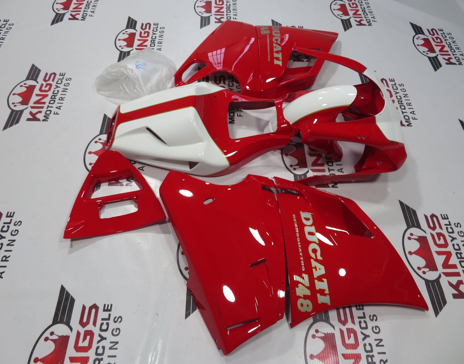 Red, White, Silver and Gold Pinstripe Fairing Kit for a 1998, 1999, 2000, 2001, & 2002 Ducati 996 motorcycle. The photos used are examples of the paint design. Your Ducati 996 will have 996 sticker decals, not 748 decals