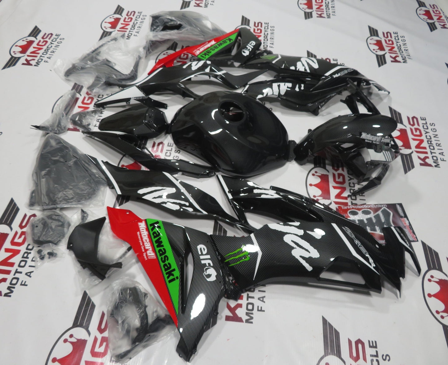 Shop Faux Carbon Fiber, Red and Green Fairing Kit for a 2019, 2020, 2021, 2022 & 2023 Kawasaki Ninja ZX-6R 636 motorcycle from KingsMotorcycleFairings.com