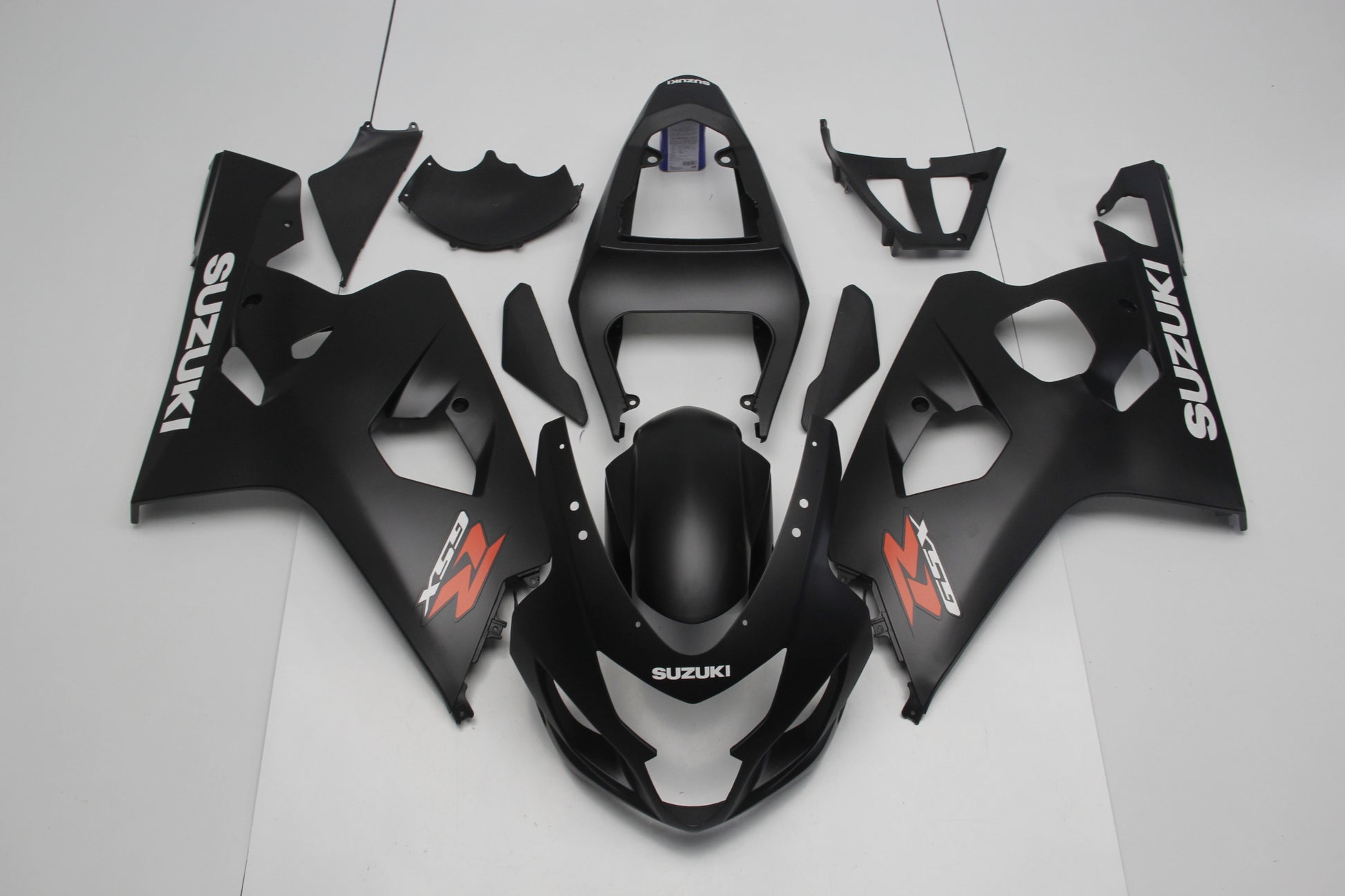 Matte Black, White and Red Fairing Kit for a 2004 & 2005 Suzuki GSX-R750 motorcycle