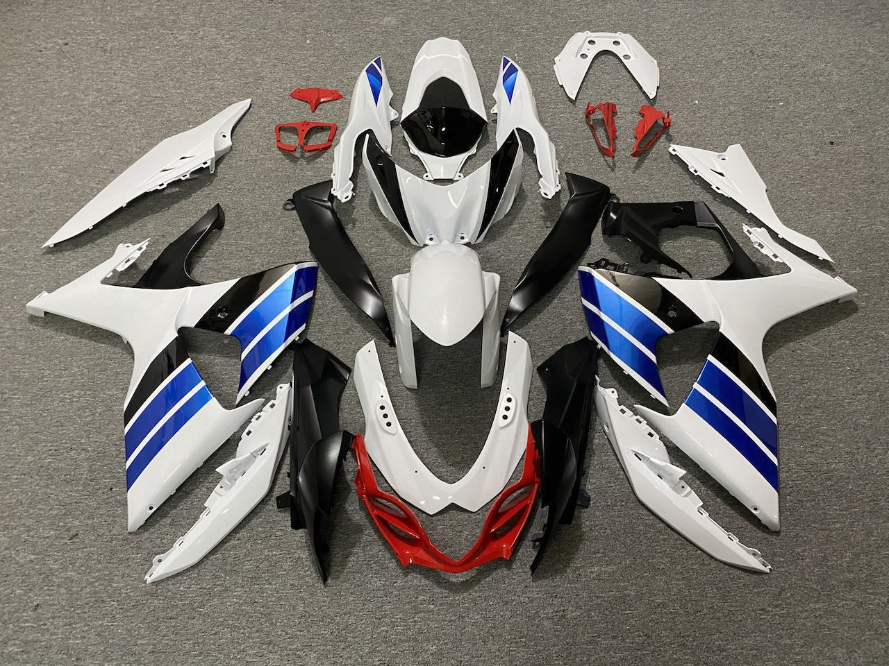 White, Blue, Black and Red Fairing Kit for a 2009, 2010, 2011, 2012, 2013, 2014, 2015 & 2016 Suzuki GSX-R1000 motorcycle